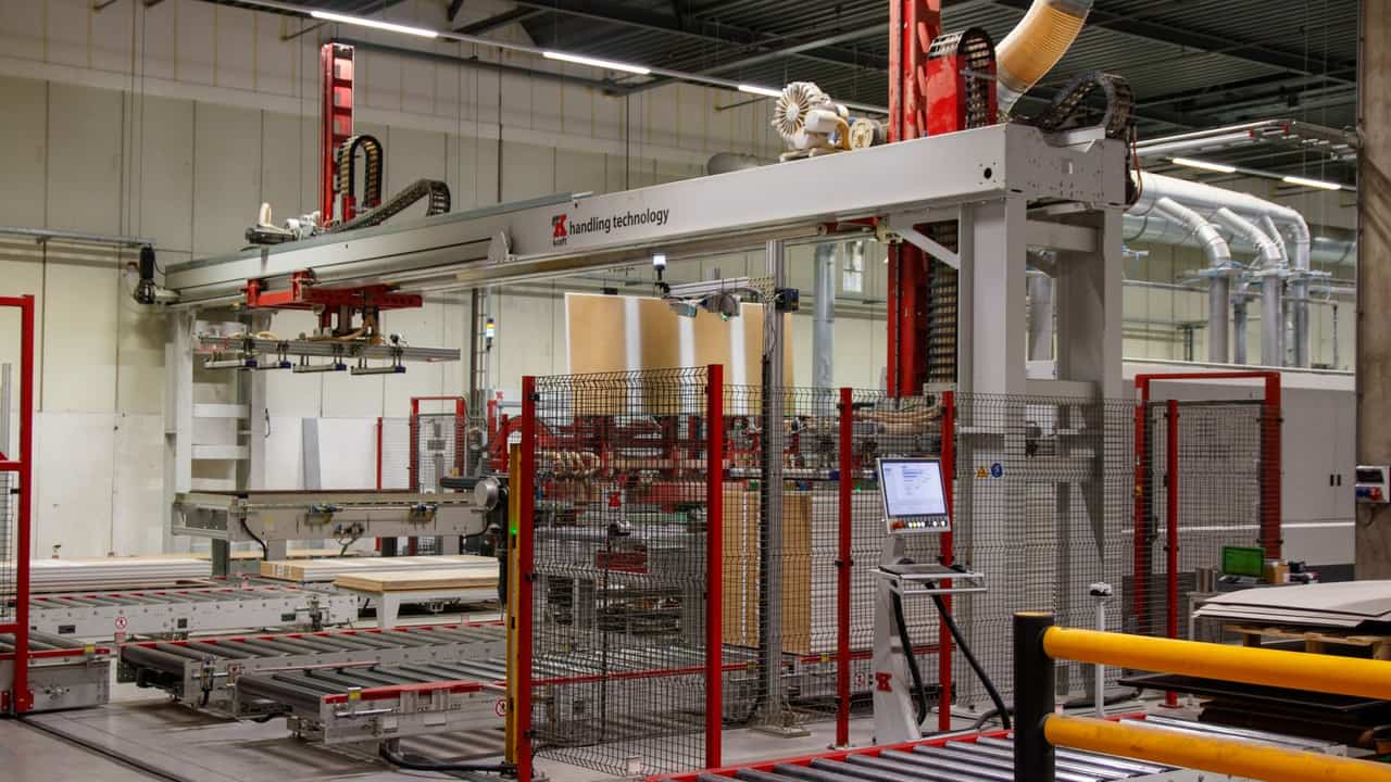 Automated manufacturing machinery and cable carriers in a real factory
